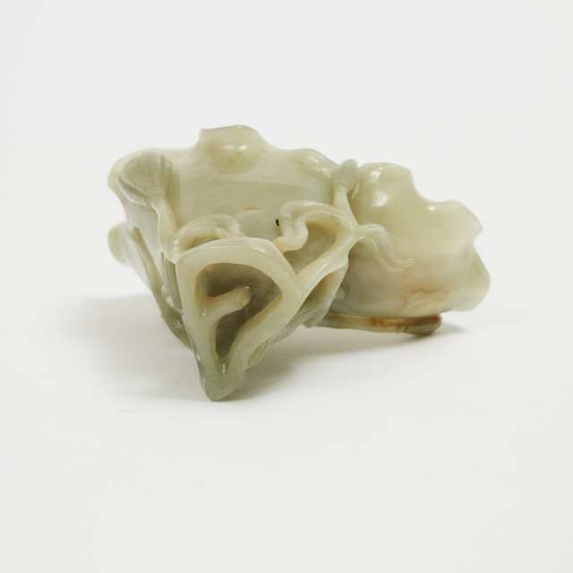 A Carved Celadon and Russet Jade 'Lotus Flower' Libation Cup